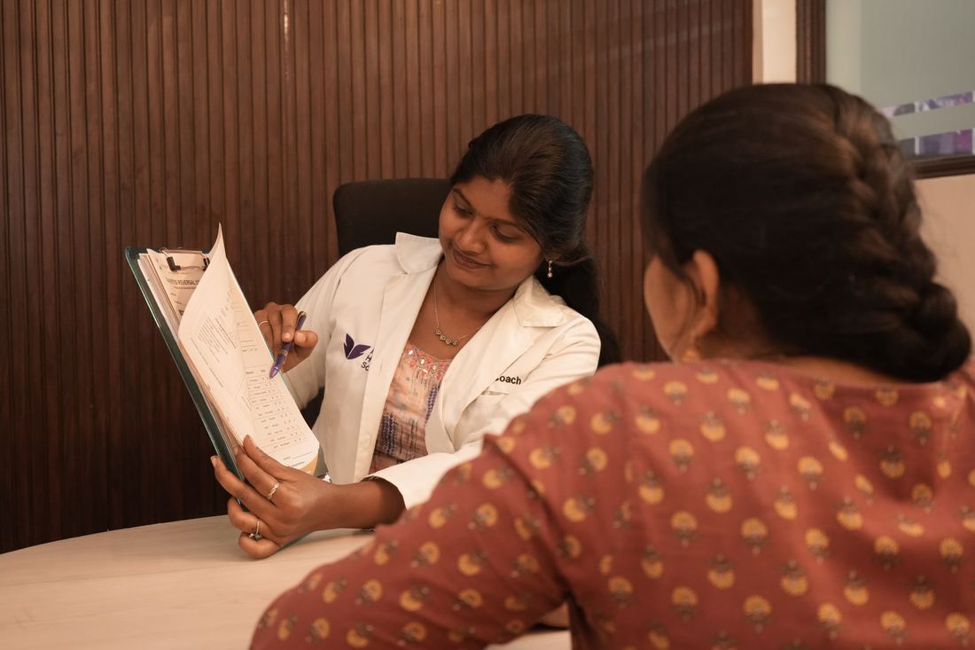 A Longer Life Wellness health coach reviewing a progress chart with a member
